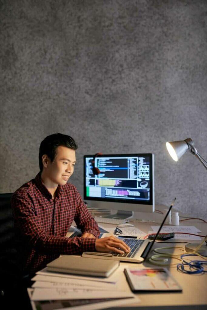 Cheerful Vietnamese programmer at our web design agency in Vietnam