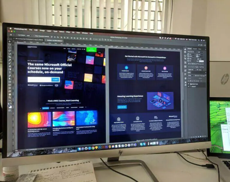 a computer showing web design services on split screen.