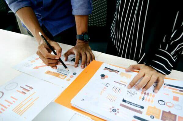 two people looking at competitor seo analysis charts