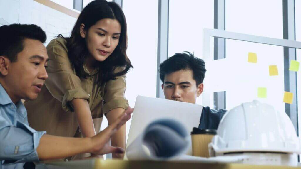 our team of young Asian ppc experts at web design saigon discussing a campaign.