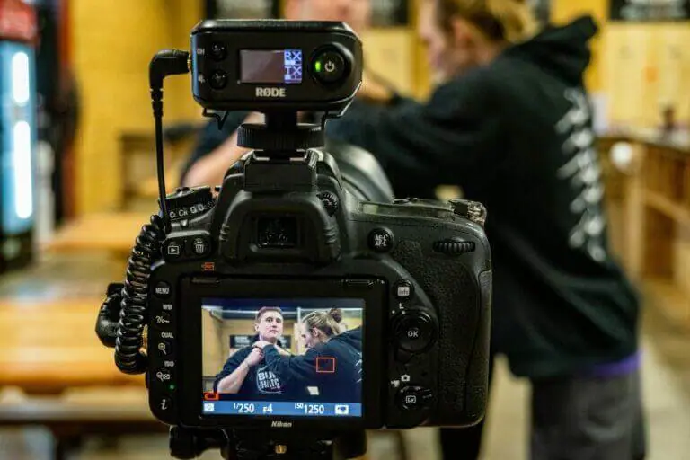 A content creator recording some content with a camera for social media marketing content.