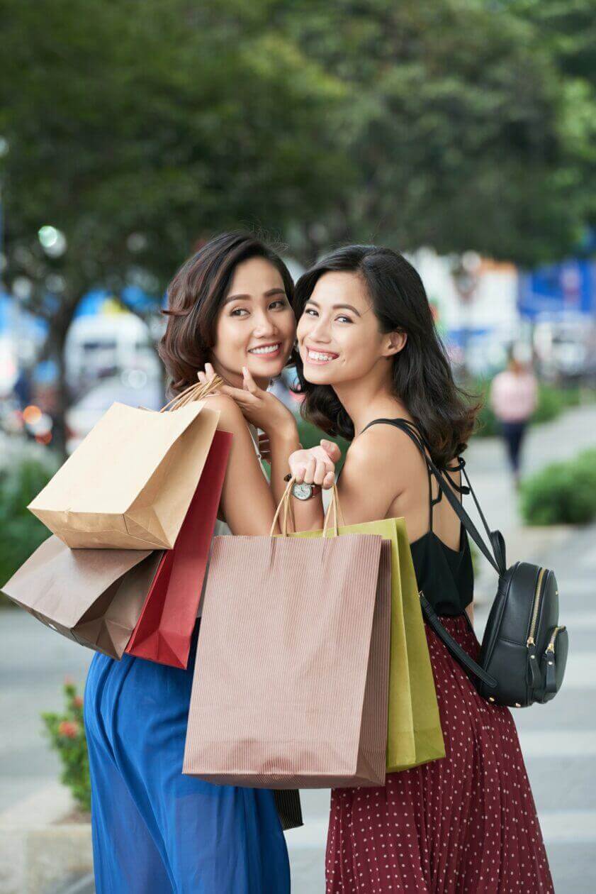 Beautiful Women with many Shopping Bags due to business having successful local seo