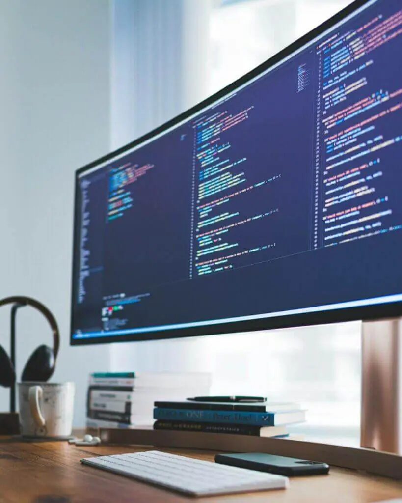 a computer showing lines of code as part of a web development service in vietnam.