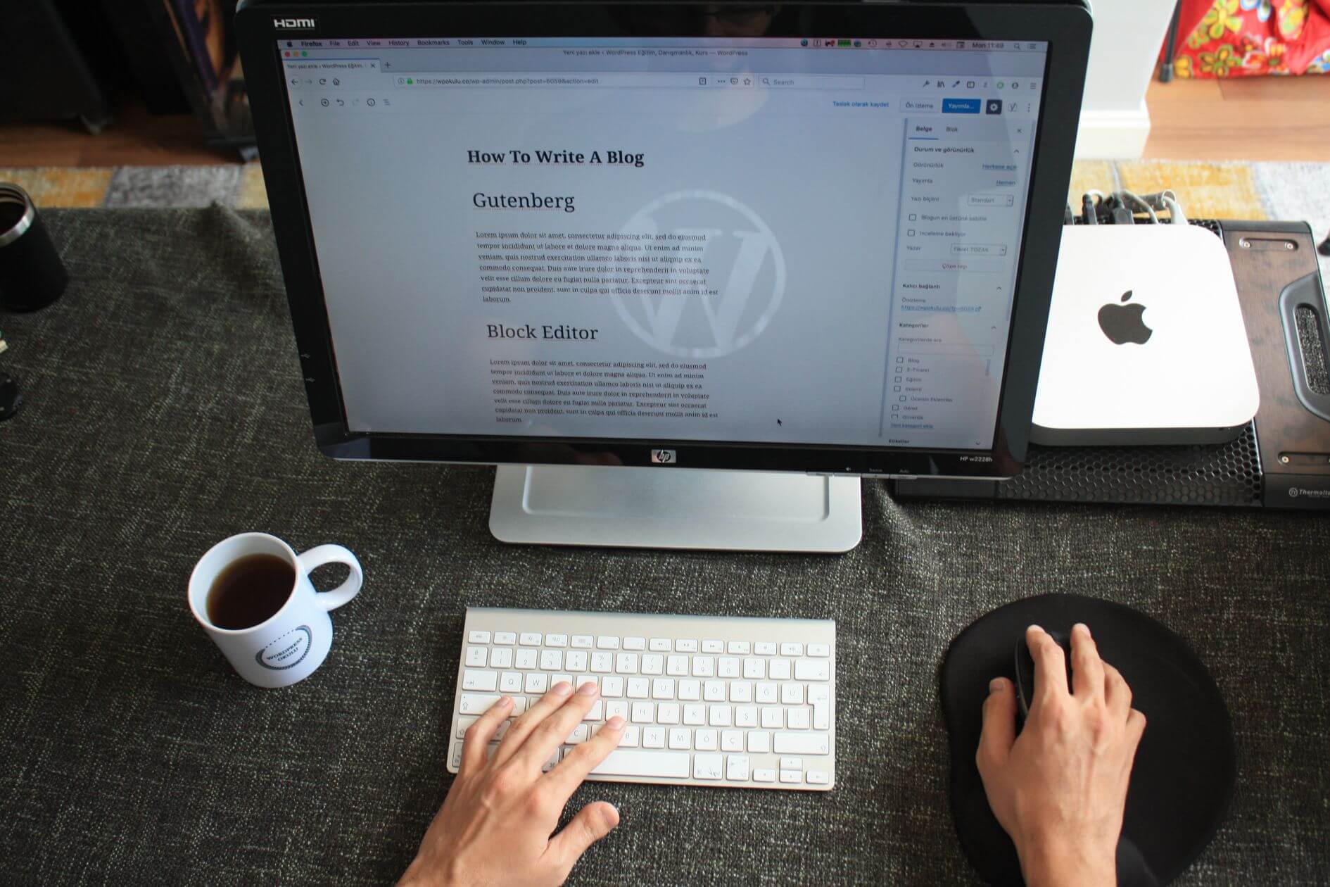 a blog writer with a laptop and keyboard providing blog writing services in vietnam