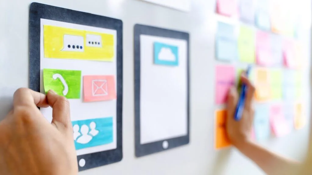 What Is A UI UX Design Agency? - Web Design Saigon UI applications designer working for smart phone interface.