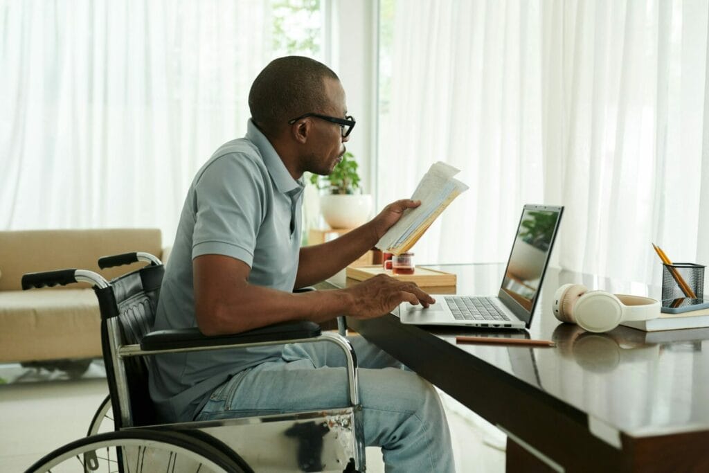 Man with Disability Checking Medical Documents