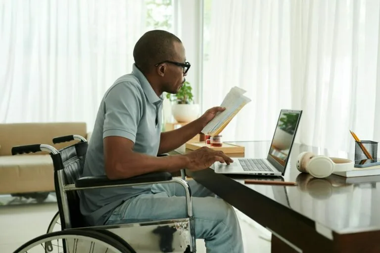Man with Disability Checking Medical Documents